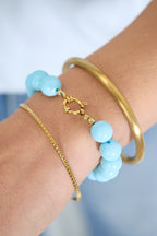 Kleurrijke kralenarmband dames met goudkleurige details
