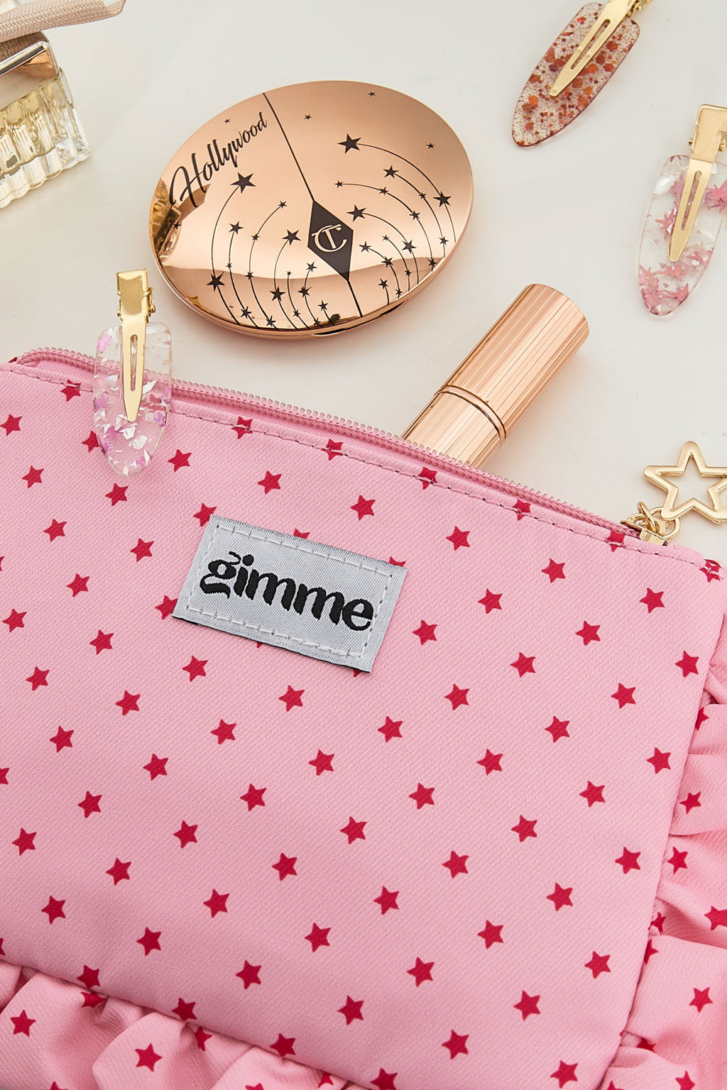 Make-up tasje met sterrenprint en ruches