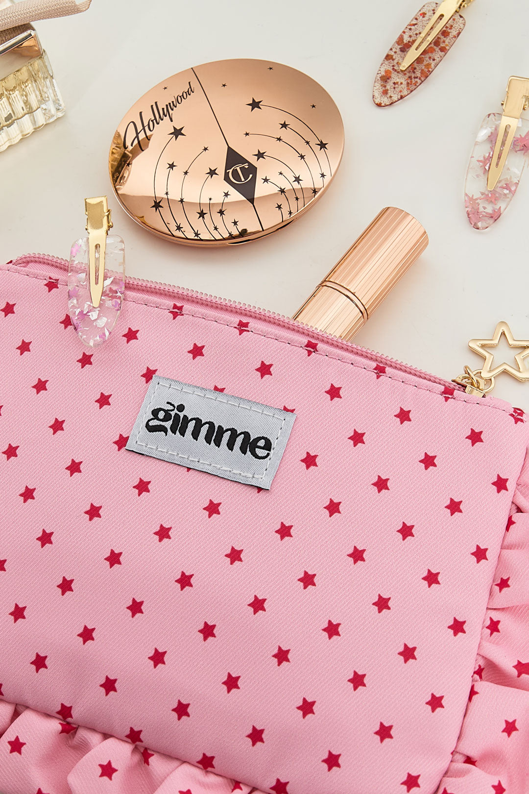 Make-up tasje met sterrenprint en ruches